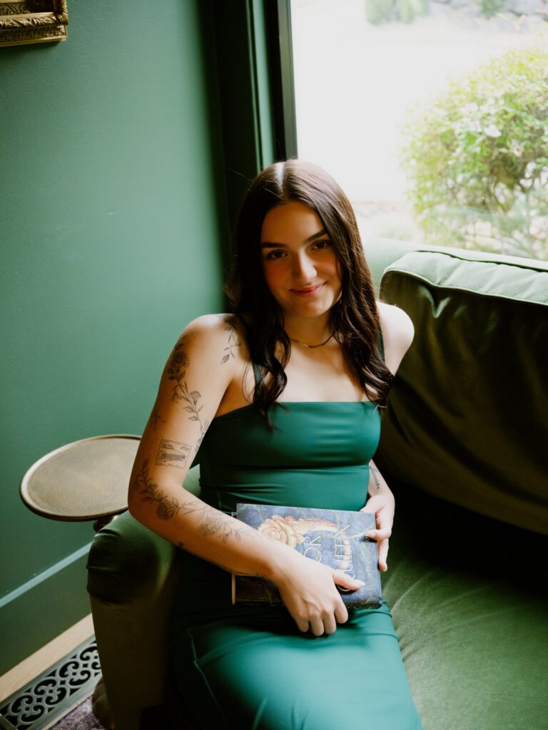 Carmen Garringer curates the book selection at Verse & Vine, stocking the shelves with romance titles she loves and books she thinks customers will enjoy.