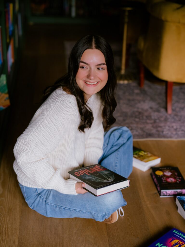 Carmen Garringer orders books for Verse & Vine, which opened with about 1,400 titles and has already reordered its inventory multiple times.