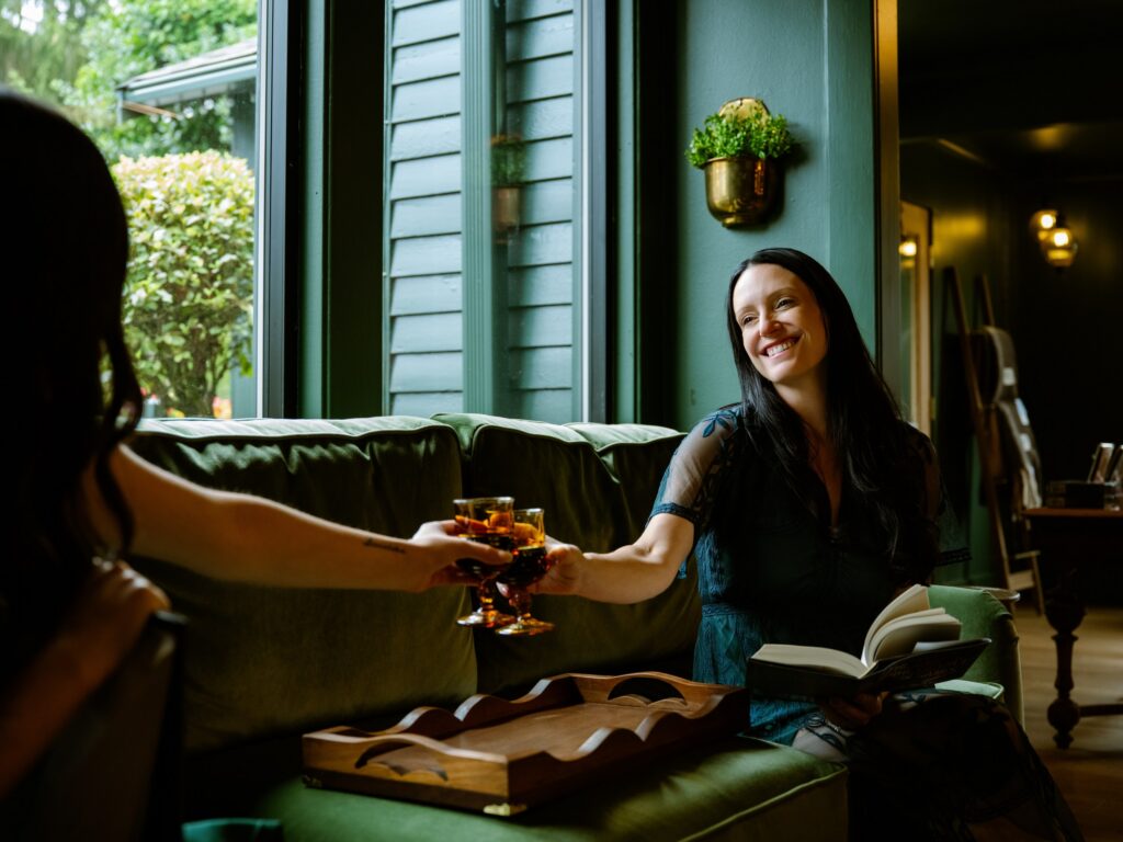 Jaci Bryant and Carmen Garringer toast the opening of Verse & Vine, their mother-daughter bookstore and wine bar.