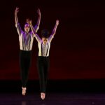 Peninsula Dance Theatre dancers perform onstage.