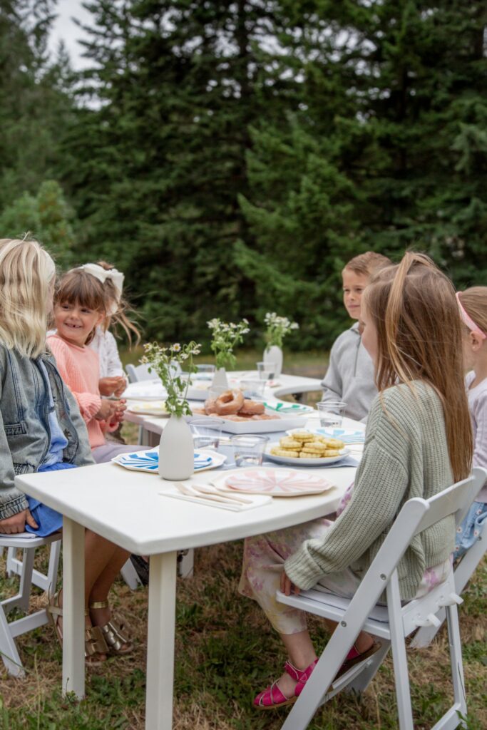 Young guests gather around the table during a celebration planned by Erickson Event Design.