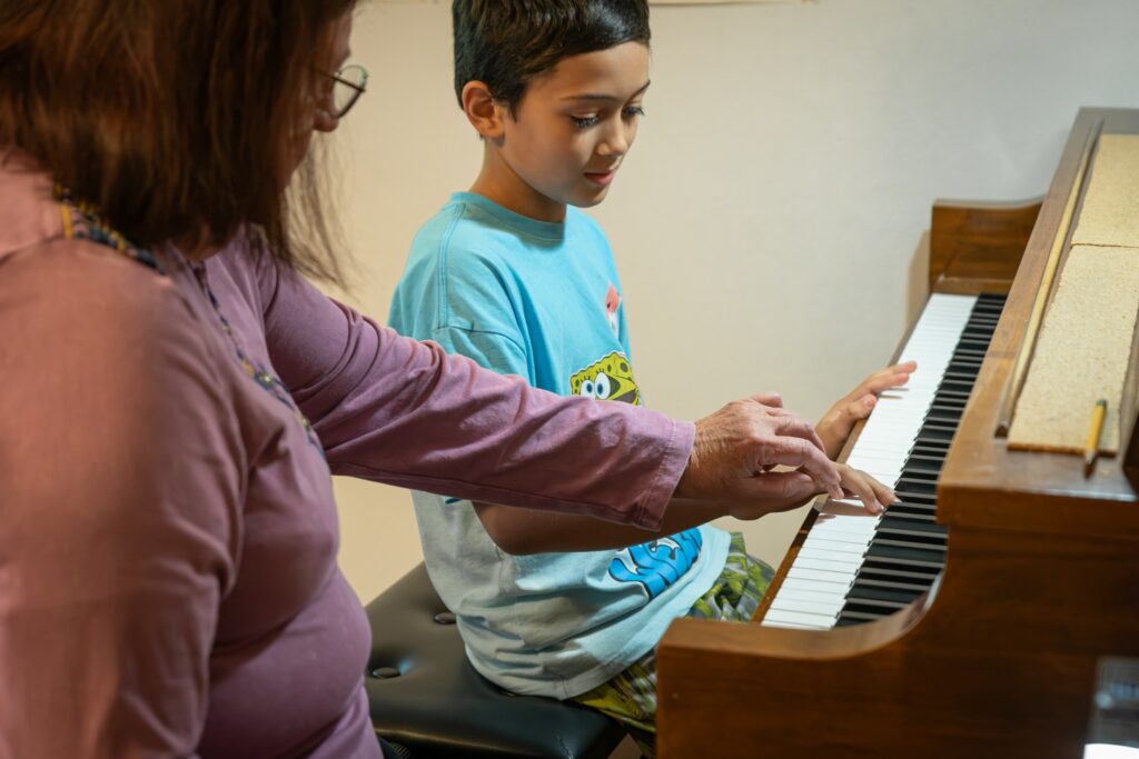Christine Kastanopolous works with a student during a piano lesson at her Silverdale studio.